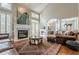 Spacious living room with fireplace and ample seating at 3502 Village Green Dr, Roswell, GA 30075