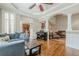 Open living room with hardwood floors and views into the kitchen at 3502 Village Green Dr, Roswell, GA 30075
