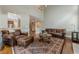 Comfortable living room with leather furniture and hardwood floors at 3502 Village Green Dr, Roswell, GA 30075