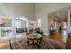 Spacious living room with hardwood floors, arched doorways, and elegant decor at 3502 Village Green Dr, Roswell, GA 30075