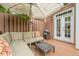Cozy outdoor patio with comfortable seating, grill, and umbrella, perfect for relaxing and entertaining at 3502 Village Green Dr, Roswell, GA 30075