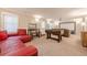 Spacious basement recreation room featuring a foosball table and a large screen projection TV at 3502 Village Green Dr, Roswell, GA 30075