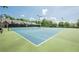 Well-maintained tennis courts with lighting, providing residents with an opportunity for recreation at 3502 Village Green Dr, Roswell, GA 30075