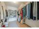 Walk-in closet with ample storage options and laminate flooring at 3502 Village Green Dr, Roswell, GA 30075