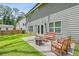Well-maintained backyard with a patio, outdoor seating, and a fire pit, offering a relaxing outdoor living space at 2362 Browns Mill Rd, Atlanta, GA 30315