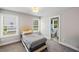 Bedroom with a bed, carpet, and an ensuite bathroom for added convenience at 2362 Browns Mill Rd, Atlanta, GA 30315