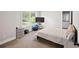 Well-lit bedroom with neutral tones, featuring a spacious layout, ample natural light, and access to a modern bathroom at 2362 Browns Mill Rd, Atlanta, GA 30315
