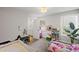 Charming bedroom featuring two beds, a cozy decor, and plenty of natural light, perfect for a shared space at 2362 Browns Mill Rd, Atlanta, GA 30315