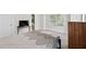 Well-lit bedroom featuring a bed, furniture, and a glimpse into the adjoining bathroom at 2362 Browns Mill Rd, Atlanta, GA 30315