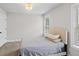 Simple bedroom with a bed, carpet, and a window for natural light at 2362 Browns Mill Rd, Atlanta, GA 30315