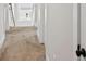 Hallway with carpet and white walls and doors, showcasing the interior architecture at 2362 Browns Mill Rd, Atlanta, GA 30315