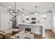 Well-lit kitchen features white cabinets, stainless steel appliances, and a large island at 2362 Browns Mill Rd, Atlanta, GA 30315