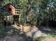 Charming backyard with a custom treehouse featuring a viewing deck, nestled among lush bamboo trees at 284 Lakeview Ne Ave, Atlanta, GA 30305