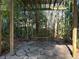 Secluded backyard features a swing on a stone patio, surrounded by bamboo, offering a peaceful retreat at 284 Lakeview Ne Ave, Atlanta, GA 30305