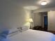 Bedroom showcasing a hardwood floor, a vintage chest, and an open doorway into another room at 284 Lakeview Ne Ave, Atlanta, GA 30305