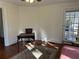 Bedroom with wood floors, small office, and door leading outside at 284 Lakeview Ne Ave, Atlanta, GA 30305