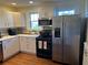 Updated kitchen featuring stainless steel appliances, hardwood floors, and ample cabinet space at 284 Lakeview Ne Ave, Atlanta, GA 30305