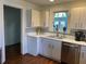Bright kitchen featuring updated appliances, white cabinets, and hardwood floors at 284 Lakeview Ne Ave, Atlanta, GA 30305