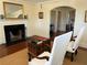 Bright living room featuring a fireplace, vintage trunk, and views to dining and kitchen at 284 Lakeview Ne Ave, Atlanta, GA 30305
