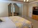 A spacious bedroom with a seating area and a large bed with yellow patterned comforter at 3008 Sunrise Ct, Conyers, GA 30094