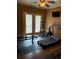 Home workout room with gym equipment and hardwood floors, perfect for fitness enthusiasts at 3008 Sunrise Ct, Conyers, GA 30094