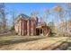 Spacious backyard featuring a home with a deck and mature trees at 340 Antebellum Way, Fayetteville, GA 30215