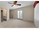 Bedroom featuring access to a bathroom, balcony access with natural light, and a ceiling fan at 340 Antebellum Way, Fayetteville, GA 30215