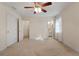 Carpeted bedroom with walk-in closet and bathroom entrances at 340 Antebellum Way, Fayetteville, GA 30215