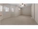 Generously sized bedroom with neutral carpet, ceiling fan and bright windows for ample sunlight at 340 Antebellum Way, Fayetteville, GA 30215