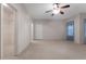 Bright bedroom with neutral carpet, ceiling fan, natural light, and a walk-in closet at 340 Antebellum Way, Fayetteville, GA 30215