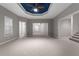 Expansive bedroom featuring gray walls, an open floorplan and a blue tray ceiling at 340 Antebellum Way, Fayetteville, GA 30215