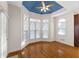 Charming breakfast nook with hardwood floors, blue ceiling accent, and many windows at 340 Antebellum Way, Fayetteville, GA 30215