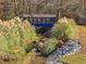 Scenic view of a blue bridge surrounded by natural greenery and a small stream at 340 Antebellum Way, Fayetteville, GA 30215