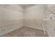 Walk-in closet with carpeted floor and extensive wire shelving at 340 Antebellum Way, Fayetteville, GA 30215