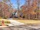 Charming brick home with a long driveway, mature trees, and well-kept lawn on a quiet street at 340 Antebellum Way, Fayetteville, GA 30215