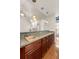 Kitchen wet bar featuring granite countertops, rich wood cabinets, and modern pendant lighting at 340 Antebellum Way, Fayetteville, GA 30215