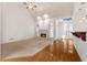Inviting living room with fireplace, hardwood floors, carpeted area, and natural light at 340 Antebellum Way, Fayetteville, GA 30215