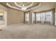 Spacious main bedroom with tray ceiling and abundant natural light at 340 Antebellum Way, Fayetteville, GA 30215