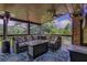 Inviting back porch featuring comfortable seating, an area rug and a ceiling fan at 3905 Greenside Ct, Dacula, GA 30019