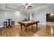 Spacious game room with a pool table and hardwood floors at 3905 Greenside Ct, Dacula, GA 30019