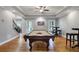 Spacious game room with a pool table and hardwood floors at 3905 Greenside Ct, Dacula, GA 30019