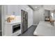 Modern kitchen with stainless steel appliances, quartz countertops and white cabinets at 3905 Greenside Ct, Dacula, GA 30019