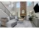 Bright living room with a stone fireplace, large windows, and neutral decor at 3905 Greenside Ct, Dacula, GA 30019