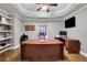 A well-appointed home office with custom built-ins and hardwood floors at 3905 Greenside Ct, Dacula, GA 30019