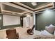 A theater room, featuring tiered seating and neutral carpeting at 3905 Greenside Ct, Dacula, GA 30019