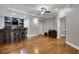 A finished basement featuring a wet bar with hardwood floors at 3905 Greenside Ct, Dacula, GA 30019