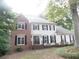 Traditional two-story home with brick and siding, featuring black shutters at 1205 Pebble Bend Dr, Grayson, GA 30017