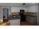 Well-equipped kitchen with granite countertops, stainless steel appliances, and ample cabinet space at 1205 Pebble Bend Dr, Grayson, GA 30017