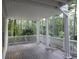 Covered porch with white railings and pillars, overlooking a wooded area at 1205 Pebble Bend Dr, Grayson, GA 30017