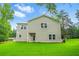 Spacious backyard with lush lawn and modern two-story home exterior at 156 Club Cir, Stockbridge, GA 30281